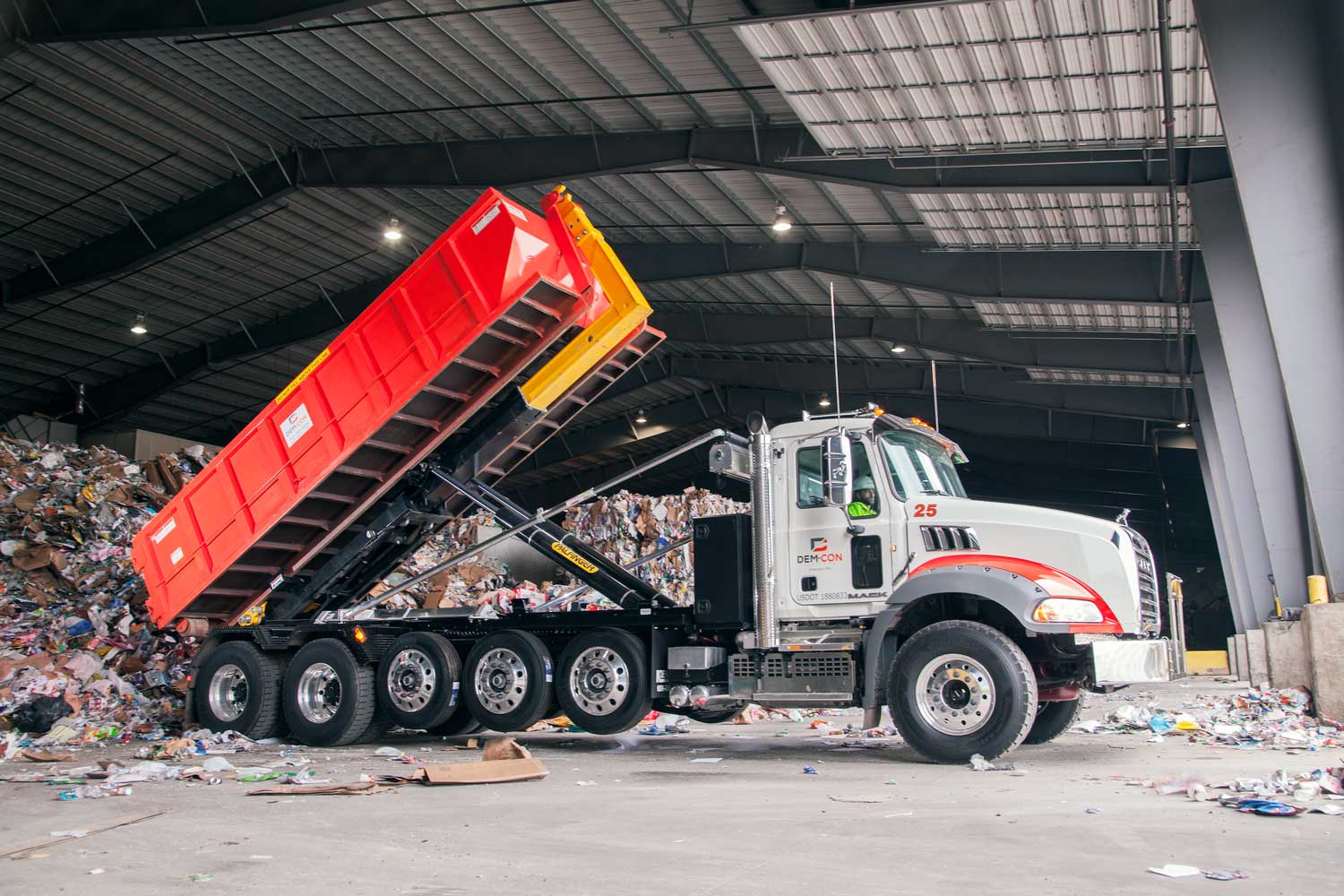 Dem-Con Dumpsters being unloaded/emptied